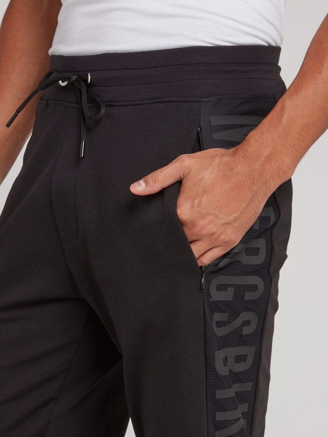 Черные брюки из флиса с лампасами и логотипом