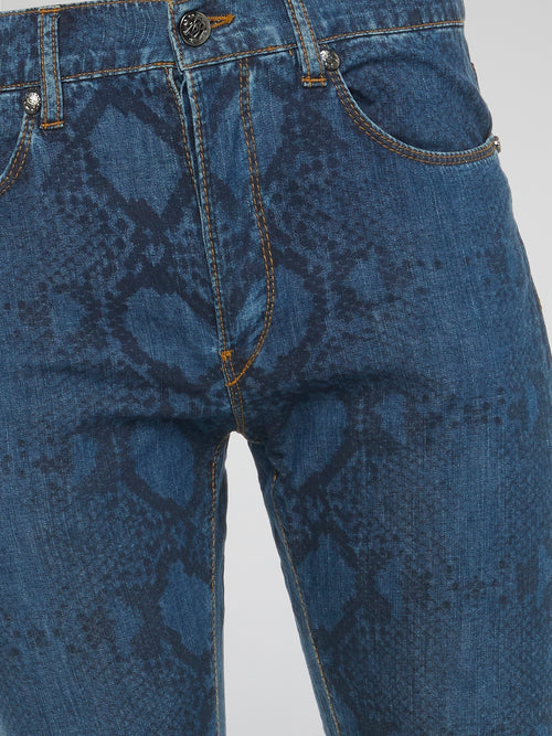 Indulge in your wild side with these fierce Snake Print Slim Fit Jeans by Roberto Cavalli. The eye-catching print and flattering fit make these jeans a must-have for any fashion-forward individual looking to make a statement. Embrace your inner fashionista and stand out from the crowd in these edgy and versatile jeans.
