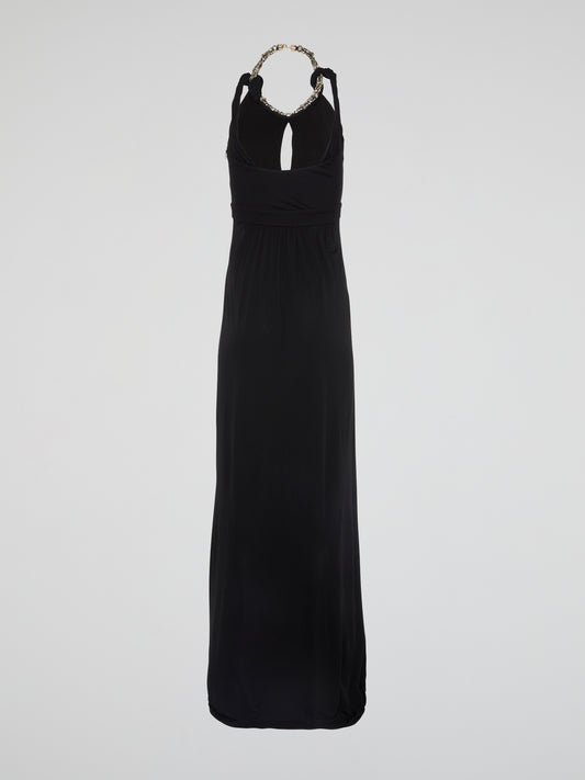 Elegance meets edgy in this show-stopping Black Crystal Embellished Halter Neck Maxi Dress by Roberto Cavalli. Adorned with shimmering crystals that catch the light with every step, this dress is sure to turn heads at any event. Whether you're hitting the red carpet or dancing the night away, this dress will make you feel like a true fashion icon.