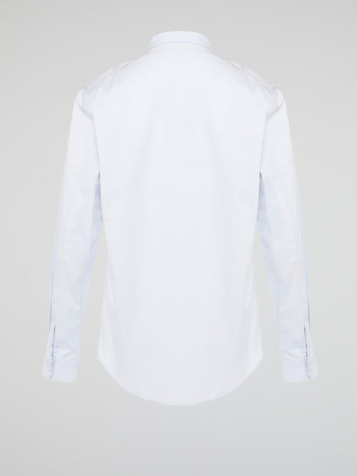 Elevate your wardrobe with the effortlessly chic White Long Sleeve Shirt by Roberto Cavalli. Crafted from luxurious fabric with impeccable attention to detail, this versatile piece exudes sophistication and glamour. Embrace a timeless look that seamlessly transitions from day to night with this must-have staple.