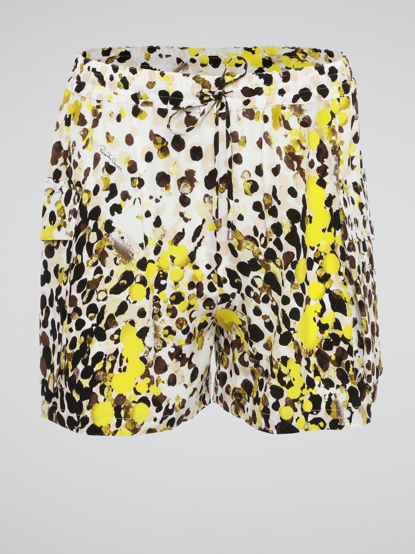 Elevate your summer style with these unique Paint Splatter Drawstring Cargo Shorts from Roberto Cavalli. Hand-painted splatters of color add an artistic flair to these classic cargo shorts, making them a standout piece in your wardrobe. Whether you're hitting the beach or exploring the city, these shorts are sure to turn heads and keep you comfortable all day long.