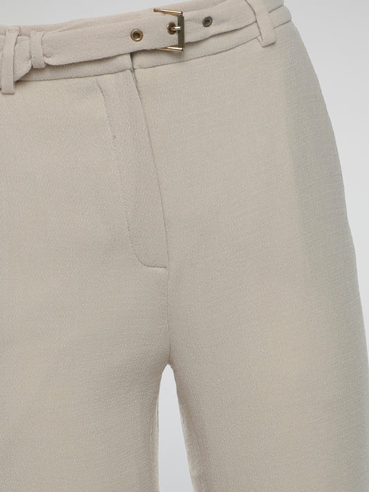 Step into the world of elegance and sophistication with Roberto Cavalli's Beige Flared Trousers. Crafted with utmost care and precision, these trousers seamlessly blend comfort and style, elevating your fashion game to new heights. Boasting a flattering flared design and a versatile beige hue, these trousers are perfect for both casual outings and formal occasions, making you the epitome of refined fashion wherever you go.