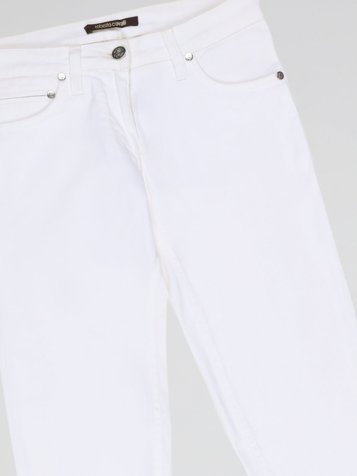 Turn heads and elevate your style with our White Straight Cut Jeans by Roberto Cavalli. Crafted with precision and attention to detail, these jeans feature a sleek and modern design that embodies sophistication and confidence. Whether you're strolling through the city or hitting the beach, these jeans are sure to make a statement and redefine your fashion game.