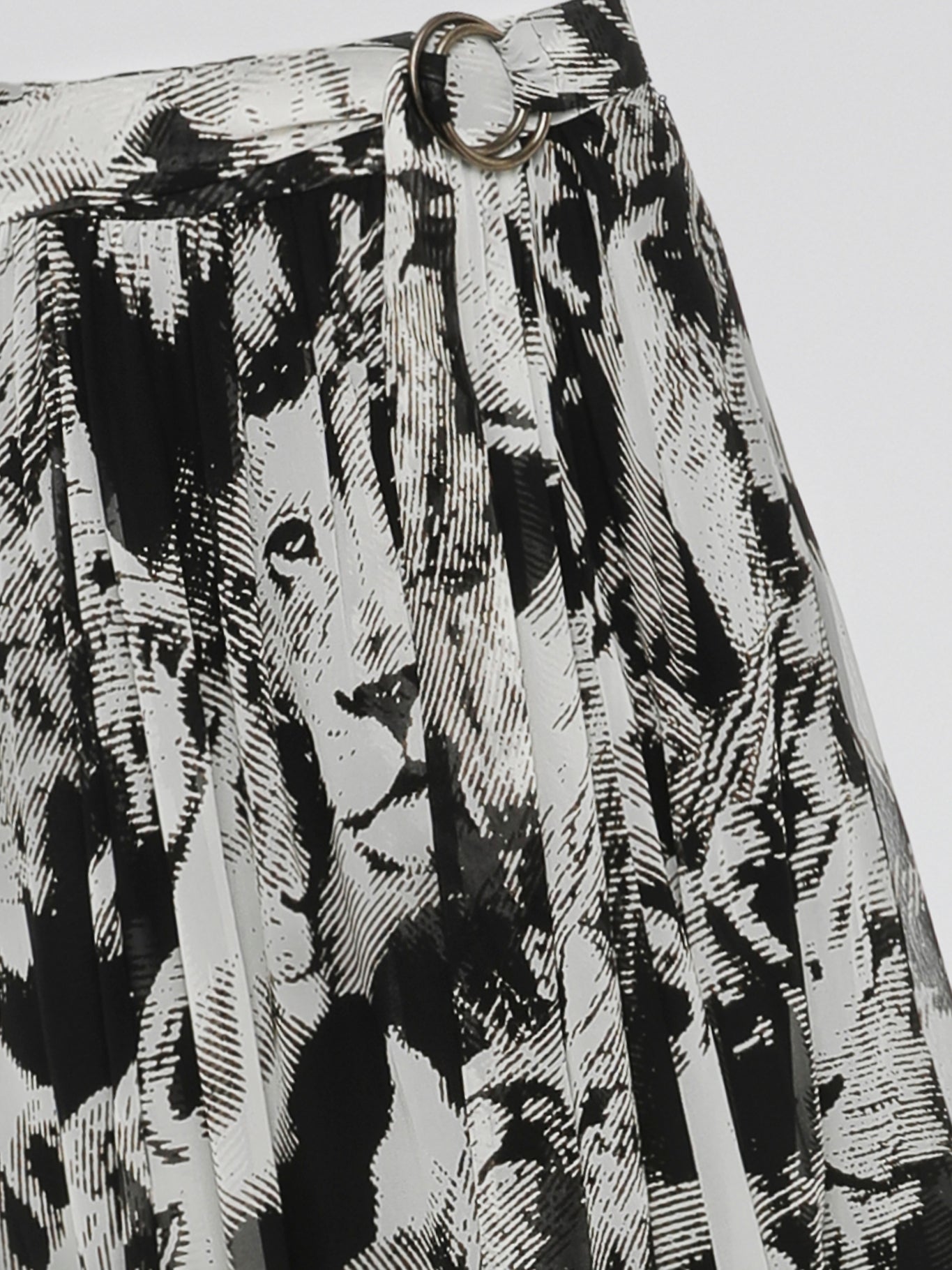 Step into the wild side with the Animal Print Pleated Maxi Dress by Roberto Cavalli. This captivating dress features a mesmerizing animal print pattern that embodies fierceness and elegance. Its pleated design effortlessly flows with every step, creating a striking silhouette that will make heads turn wherever you go.