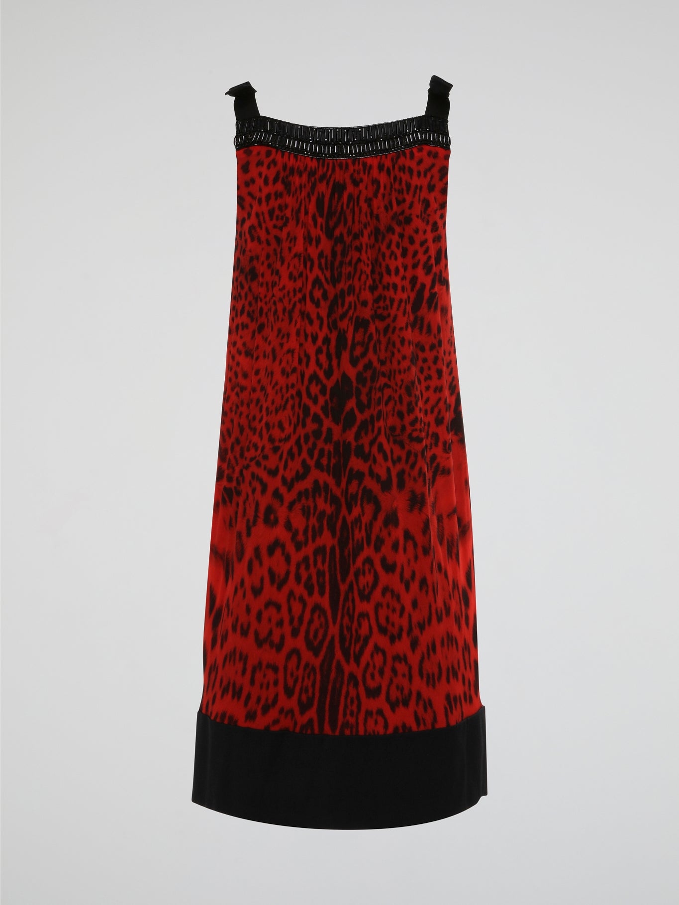 Step into the wild side with this fierce Red Leopard Print Shift Dress by Roberto Cavalli. Crafted from luxurious fabric, this dress is a statement piece perfect for any glamorous occasion. Embrace your inner fashionista and unleash your bold, confident style with this striking and stunning design.
