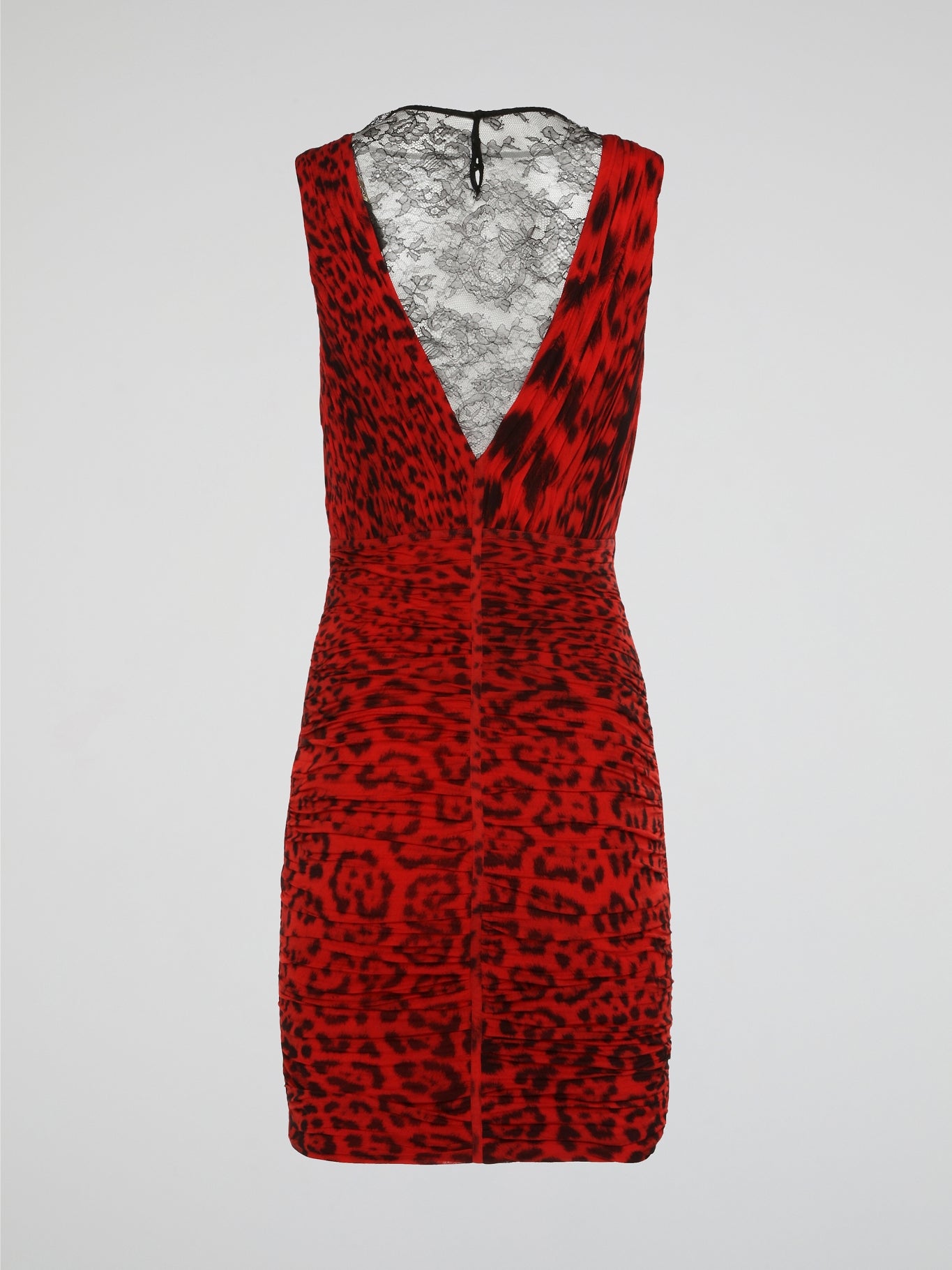 Make a fierce statement with this red leopard print ruched dress from Roberto Cavalli. The bold animal print pattern combined with the flattering ruched detailing creates a stunning and eye-catching look. Perfect for a night out or special event, this dress will make you stand out from the crowd in style.