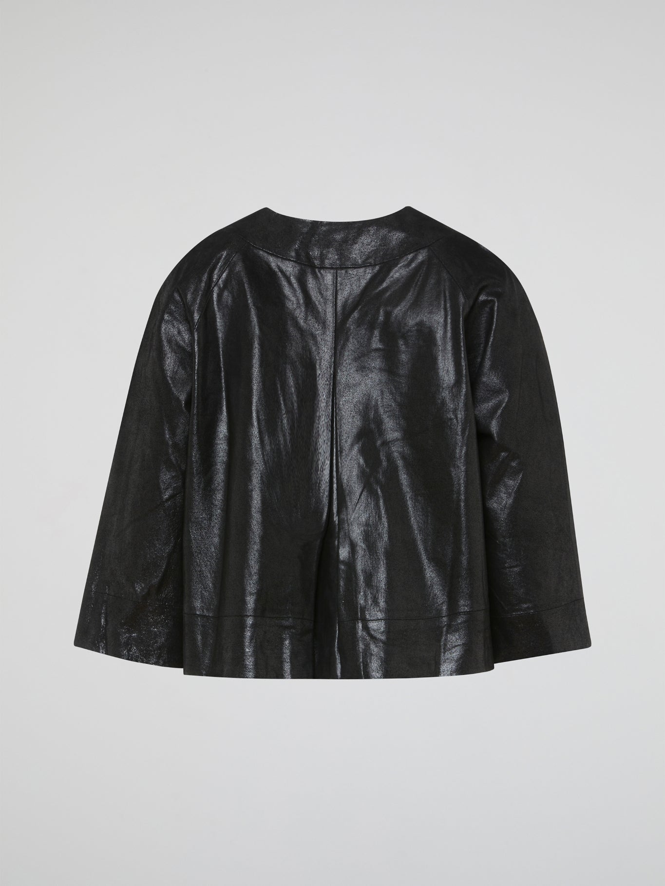 Step out in style with the Black Leather Coat from Charlotte Tarantola. Crafted from luxurious leather, this coat is a statement piece that exudes confidence and sophistication. The perfect addition to any wardrobe, this coat will elevate any outfit and have you turning heads wherever you go.