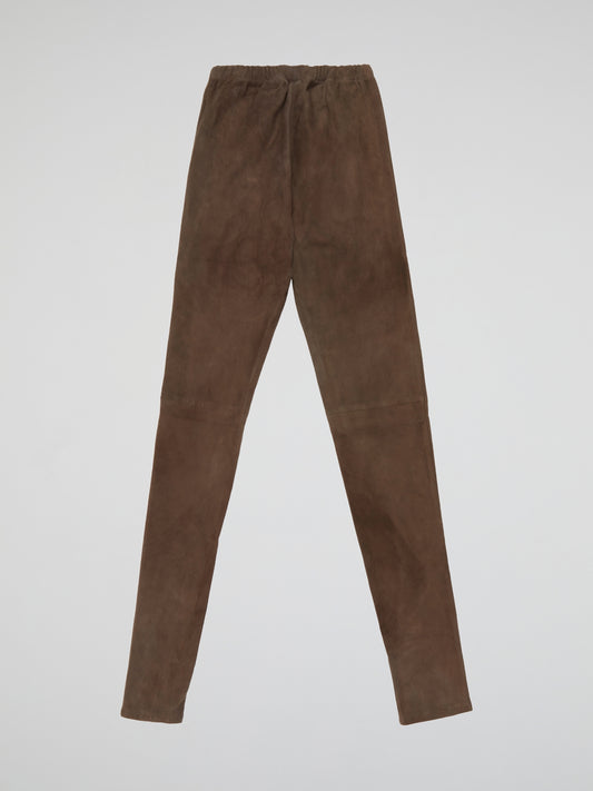 Indulge in luxurious comfort with our Brown Suede Trousers by Max And Moi - the epitome of chic sophistication. Crafted from the finest quality suede, these trousers offer a sleek silhouette and a touch of textural elegance. Elevate your everyday look with this statement piece that seamlessly transitions from day to night.