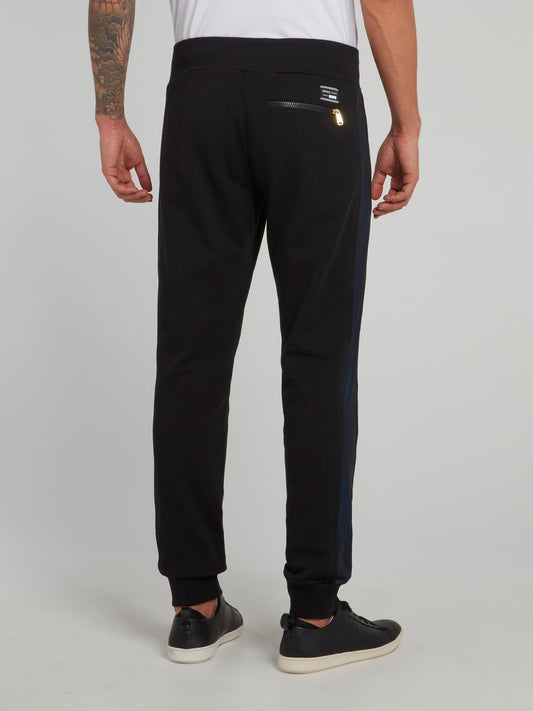 Черные спортивные брюки с молниями на карманах