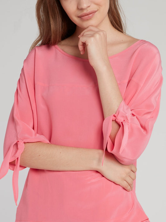 Розовая блузка с завязками на рукавах